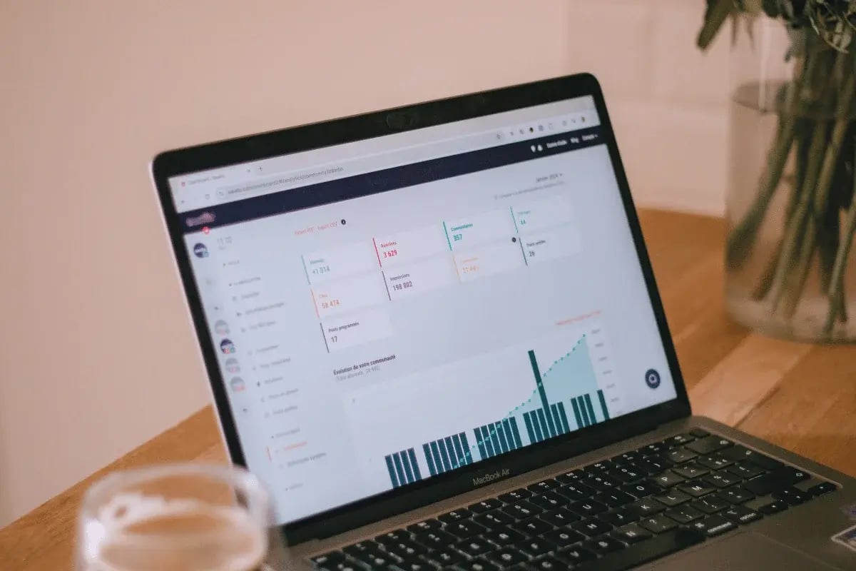 Marketing data and graphs on a laptop screen.